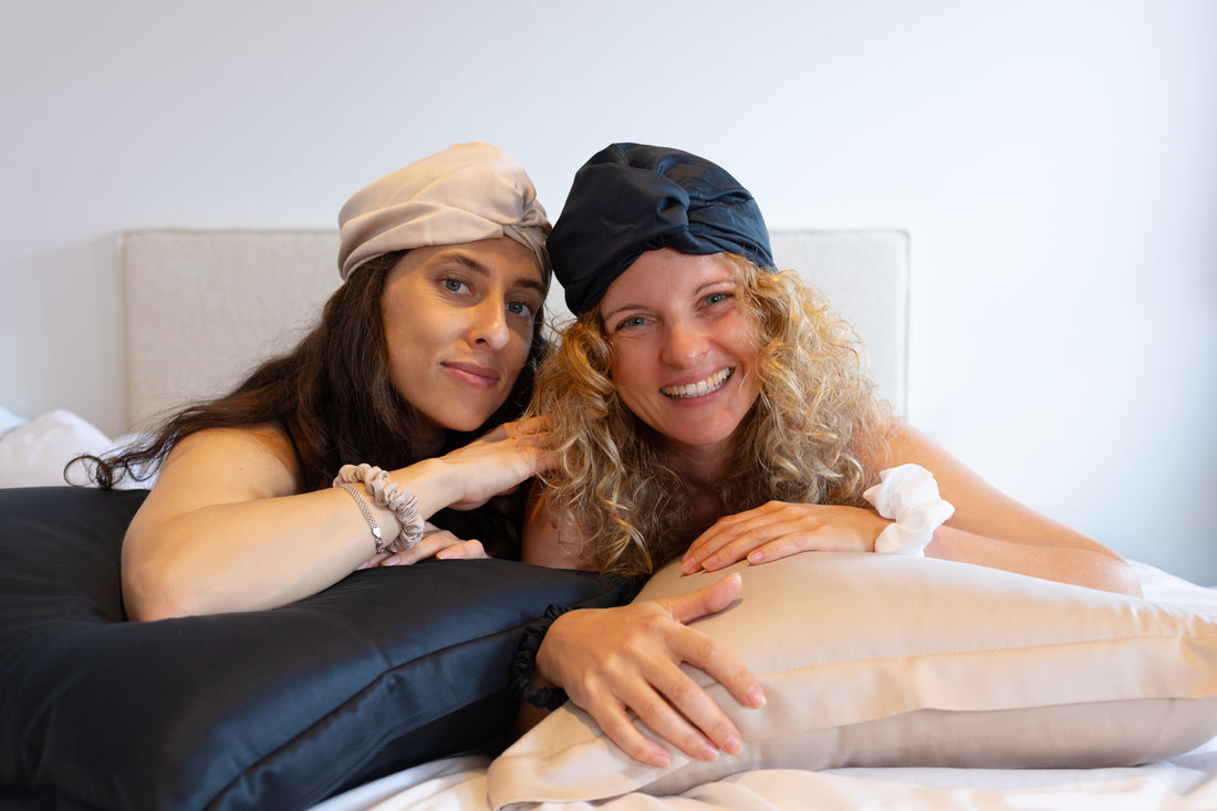 2 women with curly hair with 100% bamboo bonnet on
