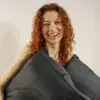 Woman holding 100% bamboo pillowcases