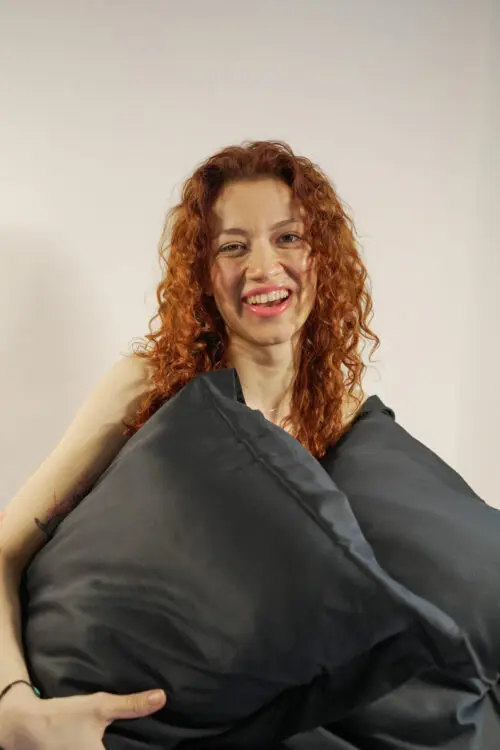 Woman holding 100% bamboo pillowcases