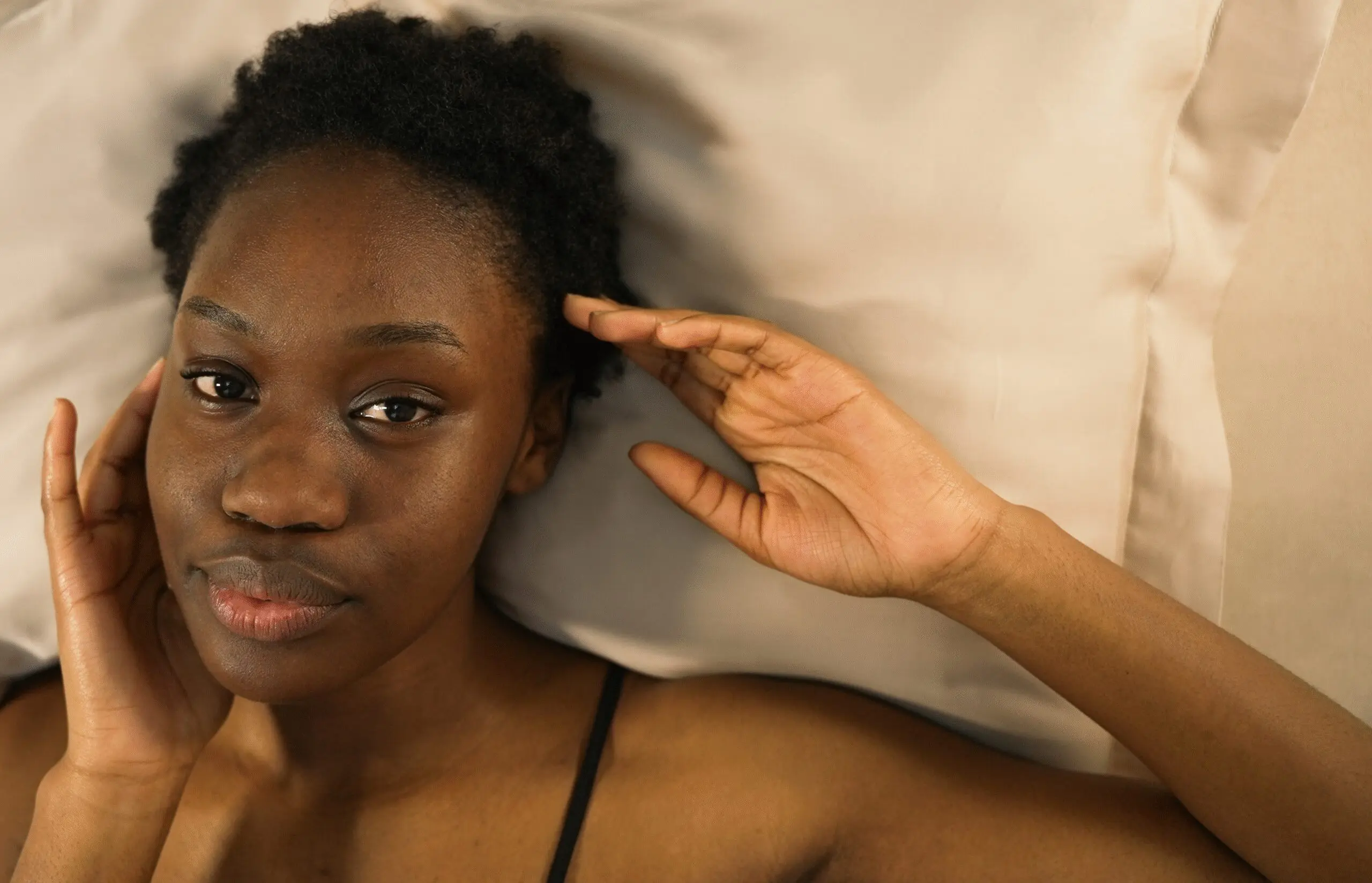 Woman with afro on bamboo pillowcase