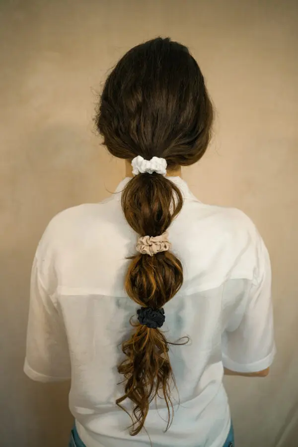 DSC00919-2 Woman wearing all 3 colours of the slim 100% bamboo scrunchie