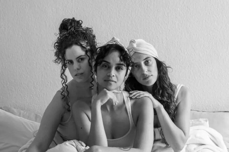 3 women with curls, 2 woman wearing 100% bamboo hair bonnet