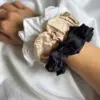 3 Classic 100% bamboo scrunchies around her wrist